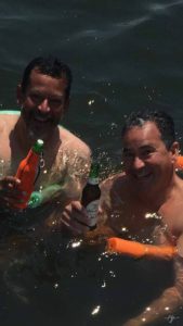 Enjoying a beer & a swim with my brother