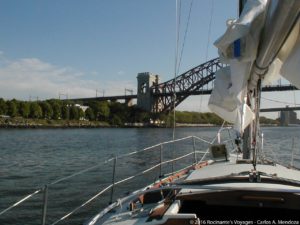 Sailing under a train trestle